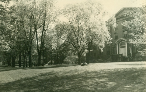 Front of Dixon Hall with lawn and trees