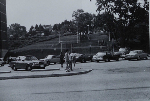 Parking lot and steps up hill to another lot