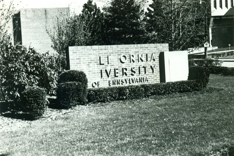 Damaged California University campus sign