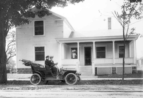 Mr. and Mrs. L.V. Kupper in front of home